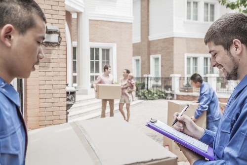 House movers planning a move in a Canary Wharf apartment building