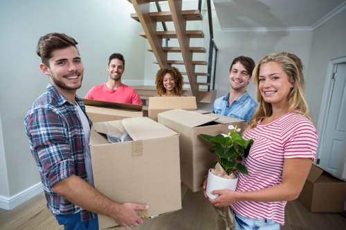 Removal team planning a move near Canary Wharf apartment buildings