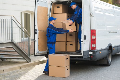 Moving team planning a home removal in a Canary Wharf apartment building
