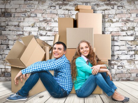 Packed boxes and furniture ready for a home move in Canary Wharf