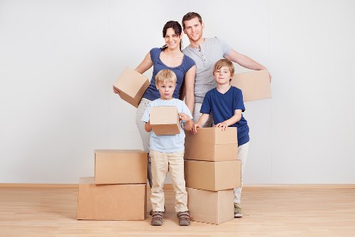 Unpacking boxes in a modern Canary Wharf home