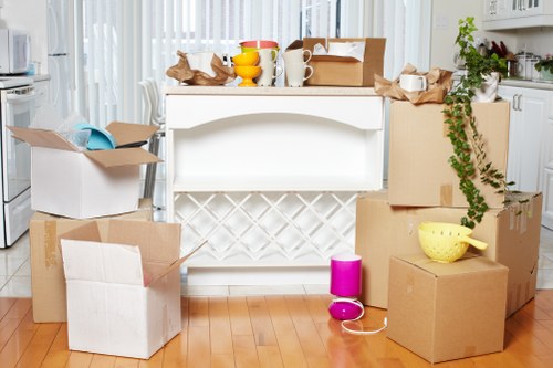 Packed moving boxes and furniture ready for loading in Canary Wharf