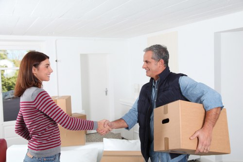 Professional movers handling apartment furniture in Canary Wharf