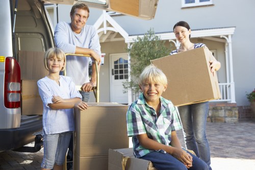 Packed boxes and furniture ready for a Canary Wharf moving van