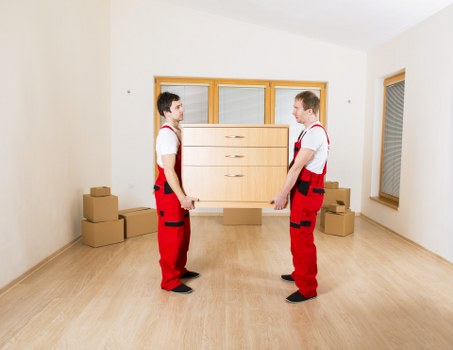 Local moving team navigating apartment access in Canary Wharf
