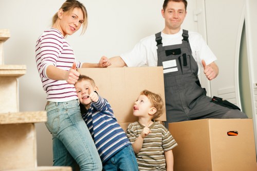 Packed boxes and furniture ready for collection in Canary Wharf